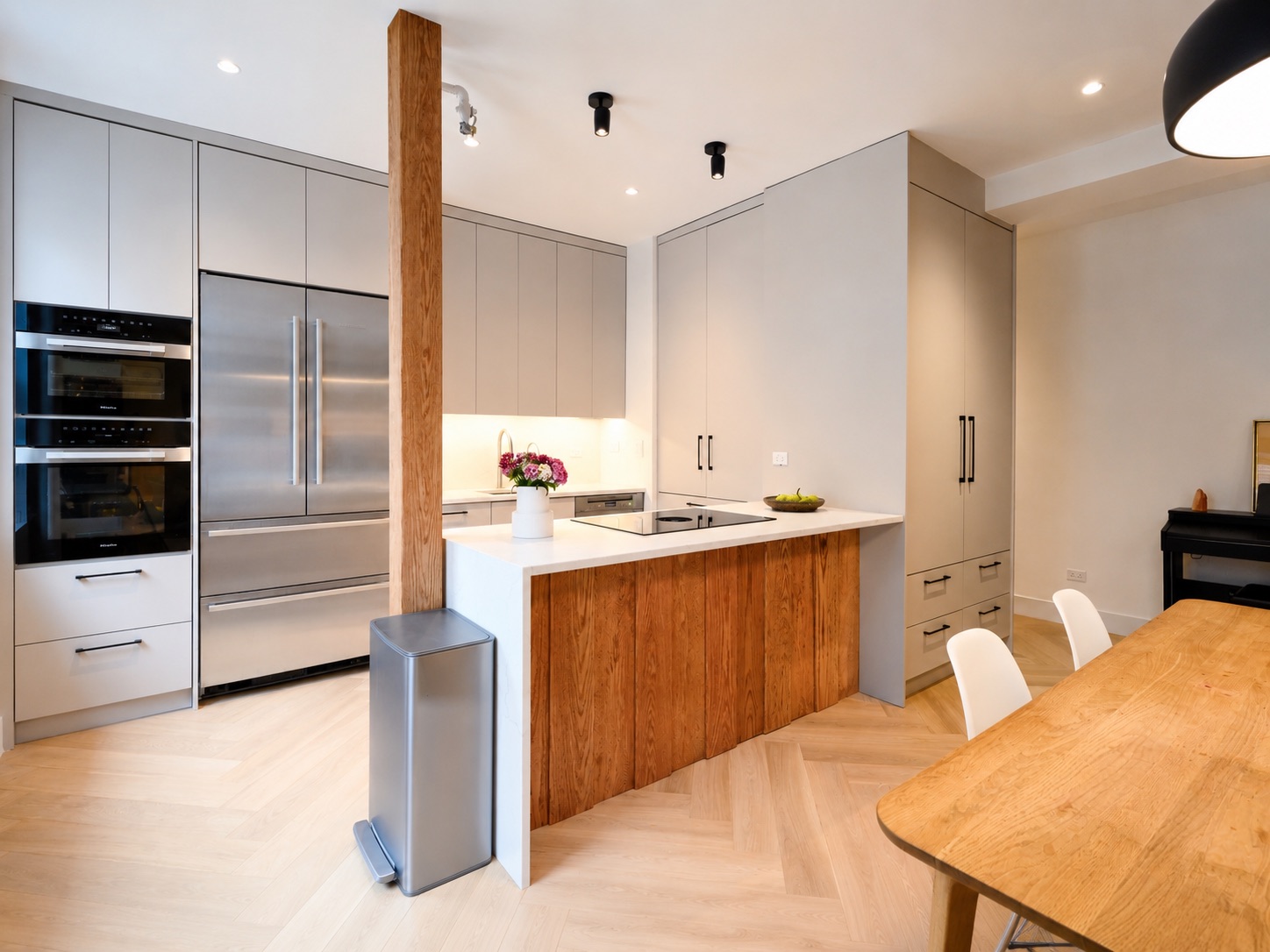 Custom white oak kitchen island with stainless appliances